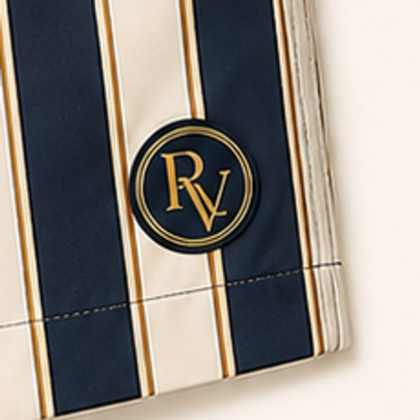 Close-up of the enamelled RV monogram badge