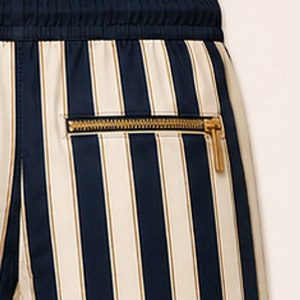 Close-up of the gold zip pocket on the back of the Riviera Stripe shorts